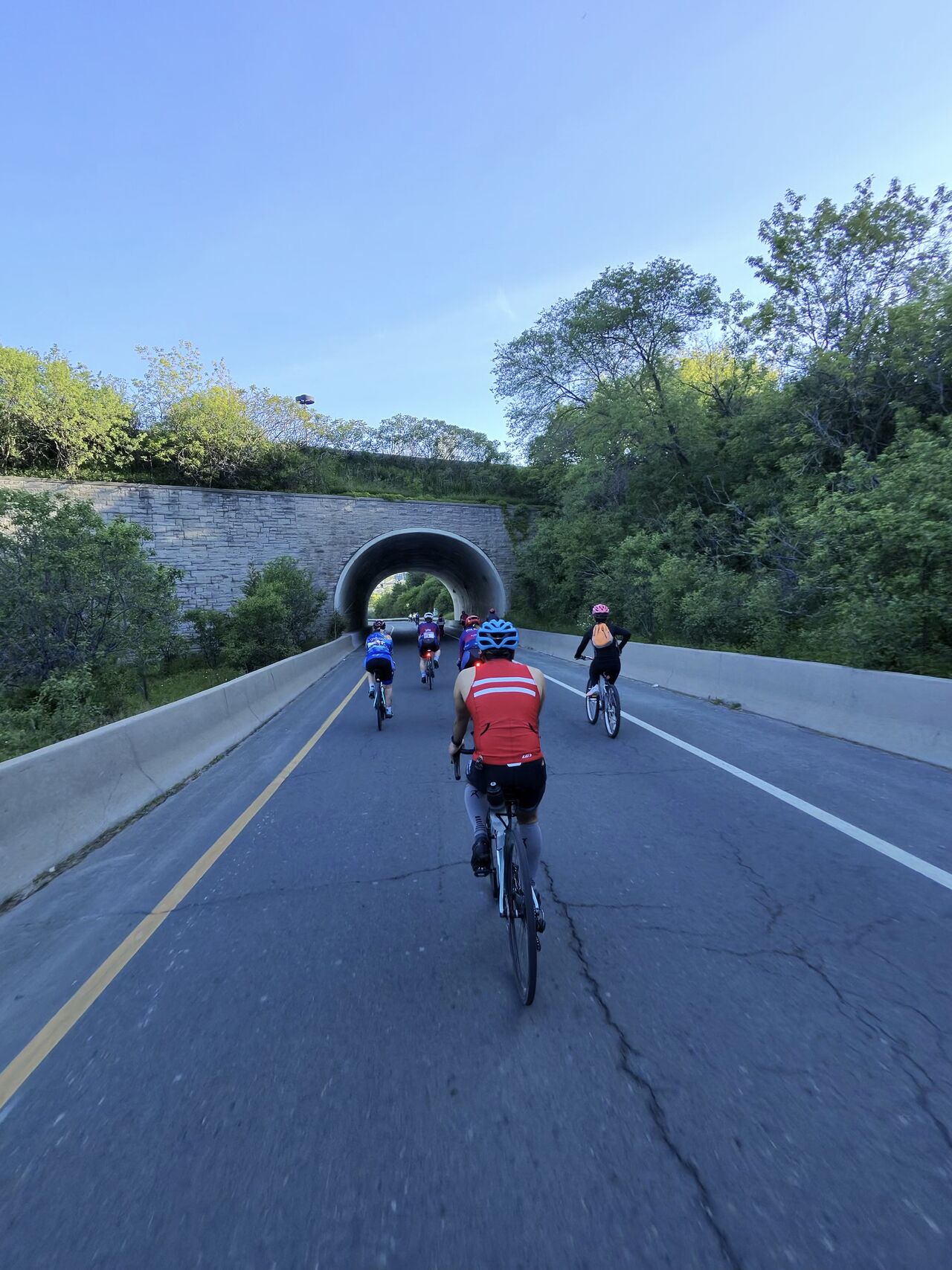 Riders heading through a tunnel on the Don Valley Parkway during Bike for Brain Health